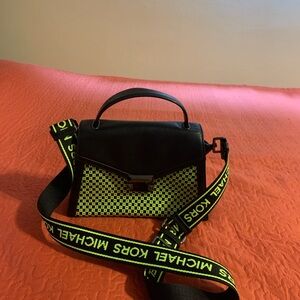 Newer used 2 times leather purse.  10 x 5.  Adjustable shoulder strap 40”.